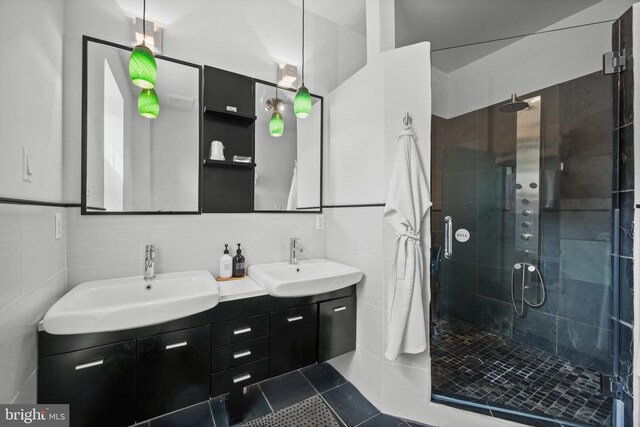 210 S High St, Baltimore, MD 21202 - full bath with double vanity, a stall shower, tile patterned flooring, and decorative backsplash