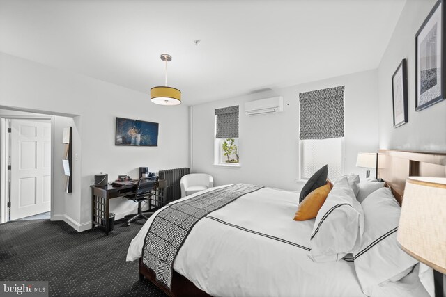 210 S High St, Baltimore, MD 21202 - bedroom with an AC wall unit, dark carpet, and an office area