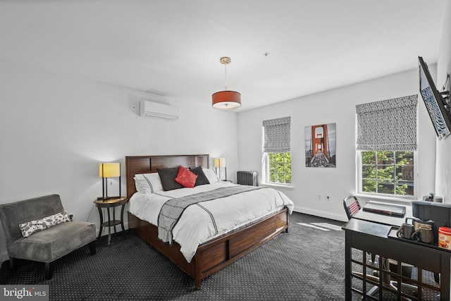 210 S High St, Baltimore, MD 21202 - carpeted bedroom featuring an AC wall unit and radiator heating unit