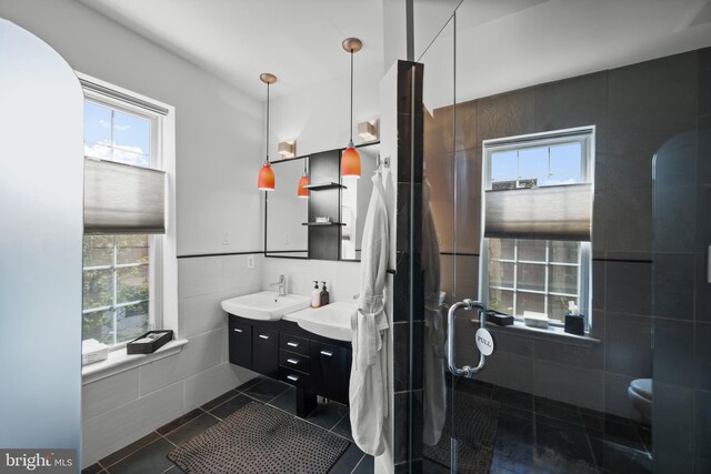 210 S High St, Baltimore, MD 21202 - bathroom with vanity, a shower stall, and tile patterned floors