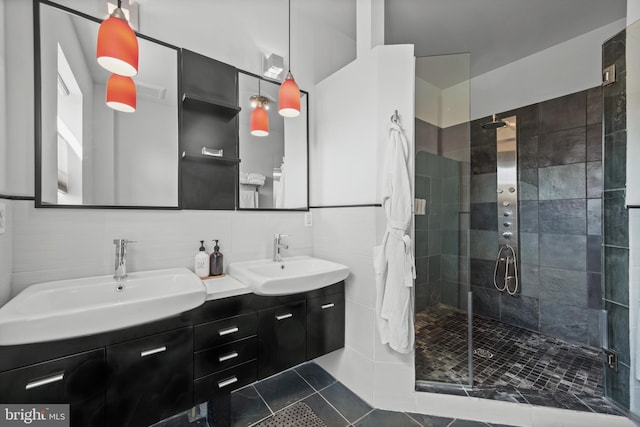 210 S High St, Baltimore, MD 21202 - bathroom with a stall shower, double vanity, tile patterned flooring, backsplash, and tile walls