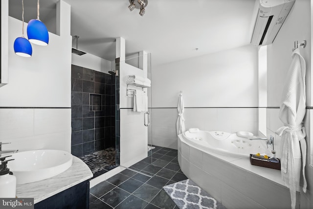 210 S High St, Baltimore, MD 21202 - full bath featuring tile walls, an AC wall unit, tiled shower, a jetted tub, and tile patterned flooring