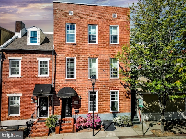 210 S High St, Baltimore, MD 21202 - view of front of property with brick siding and entry steps