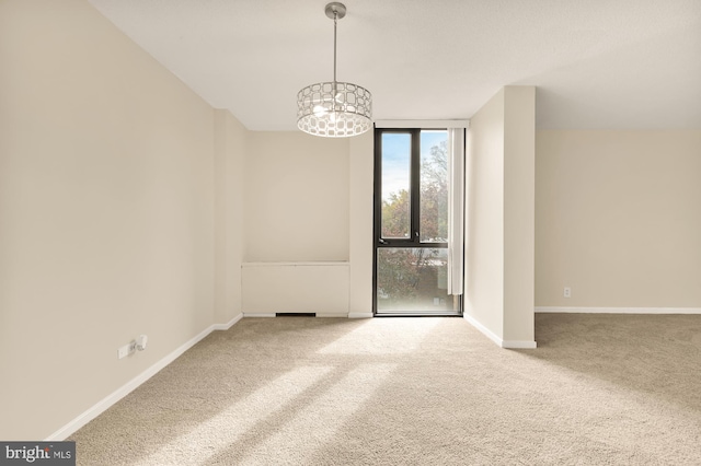 1250 4th St SW Unit W214, Washington, DC 20024 - spare room featuring carpet floors and a chandelier