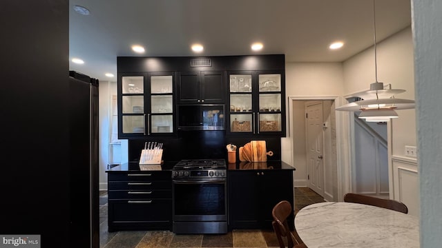 4309 Walther Ave, Baltimore, MD 21214 - kitchen with gas range, dark cabinetry, glass insert cabinets, dark countertops, and recessed lighting