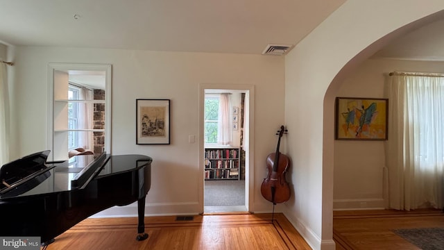 4309 Walther Ave, Baltimore, MD 21214 - home office featuring arched walkways, plenty of natural light, and wood finished floors