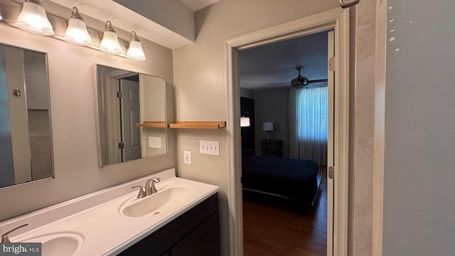 4309 Walther Ave, Baltimore, MD 21214 - bathroom featuring double vanity, wood finished floors, and ceiling fan
