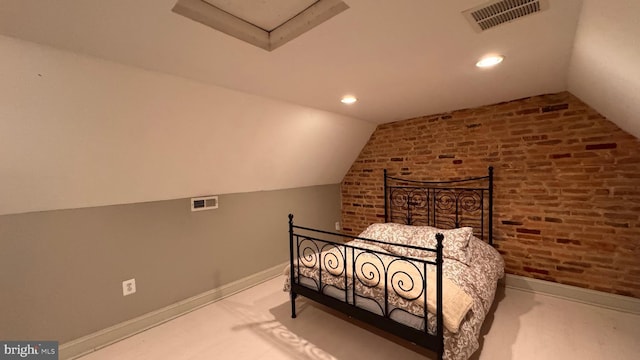 4309 Walther Ave, Baltimore, MD 21214 - carpeted bedroom with lofted ceiling, brick wall, attic access, and recessed lighting
