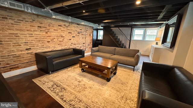 4309 Walther Ave, Baltimore, MD 21214 - living area with brick wall and stairway