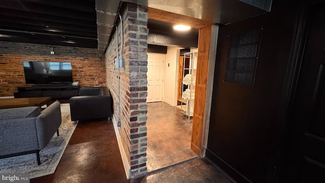 4309 Walther Ave, Baltimore, MD 21214 - living room with concrete flooring and brick wall