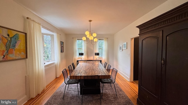 4309 Walther Ave, Baltimore, MD 21214 - dining space featuring light wood finished floors and a chandelier