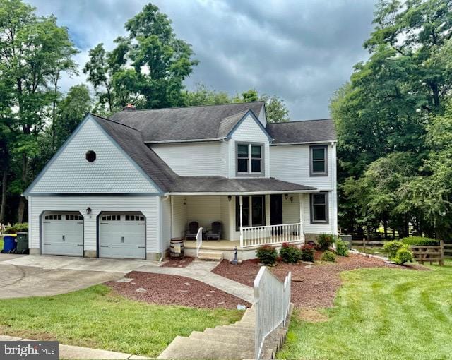 19 E Mill Station Dr, Newark, DE 19711 - view of front of house with a porch, concrete driveway, an attached garage, and a front yard