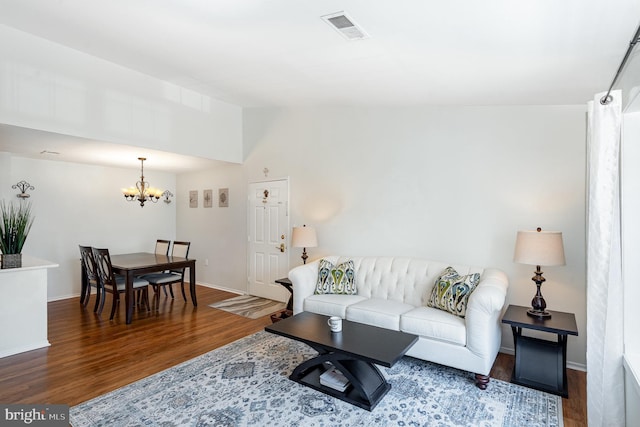 7823 Harrowgate Cir Unit D, Springfield, VA 22152 - living room with wood finished floors, a chandelier, and vaulted ceiling