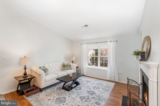 7823 Harrowgate Cir Unit D, Springfield, VA 22152 - living area featuring a fireplace with flush hearth and wood finished floors