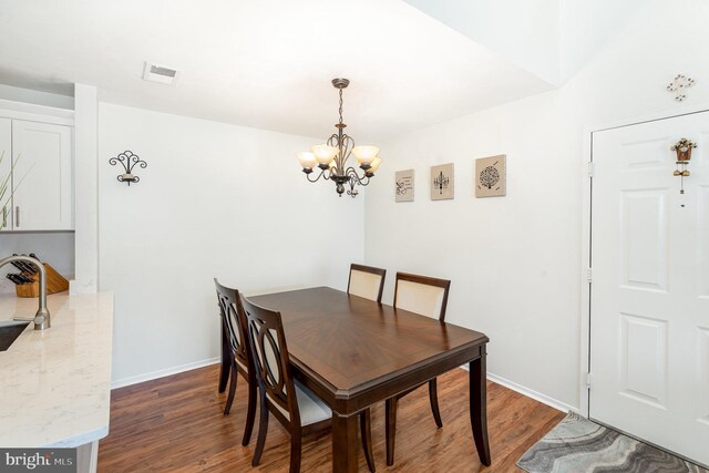 7823 Harrowgate Cir Unit D, Springfield, VA 22152 - dining space with a chandelier and wood finished floors