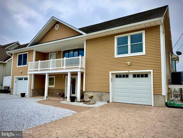 953 Capstan Dr, Forked River, NJ 08731 - view of front of home featuring a garage, a balcony, and driveway