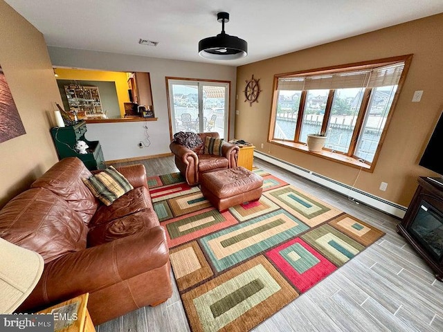 953 Capstan Dr, Forked River, NJ 08731 - living room with baseboard heating and wood finished floors