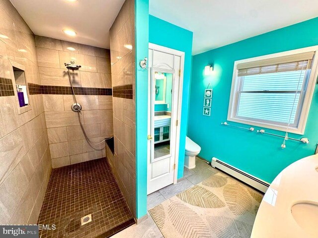 953 Capstan Dr, Forked River, NJ 08731 - bathroom with a baseboard heating unit, tiled shower, and tile patterned floors