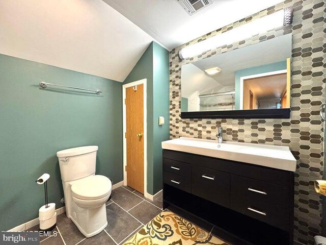 953 Capstan Dr, Forked River, NJ 08731 - full bath with lofted ceiling, vanity, and tile patterned floors