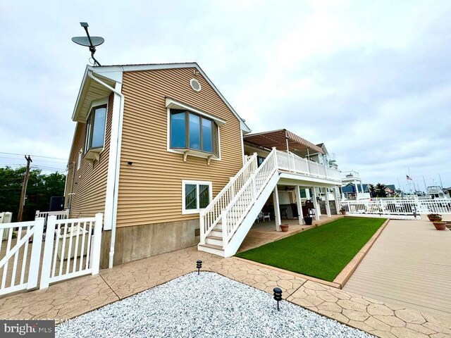 953 Capstan Dr, Forked River, NJ 08731 - rear view of property featuring stairway, a patio, and a deck