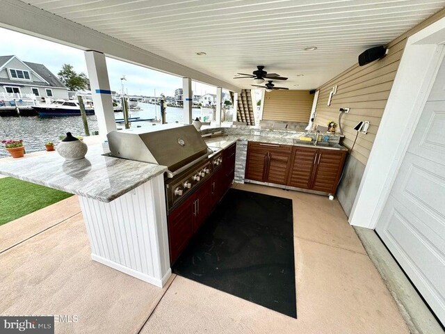 953 Capstan Dr, Forked River, NJ 08731 - view of patio featuring a water view, area for grilling, ceiling fan, and a dock