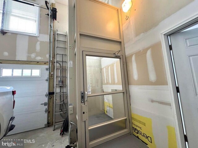 953 Capstan Dr, Forked River, NJ 08731 - doorway to outside with unfinished concrete flooring
