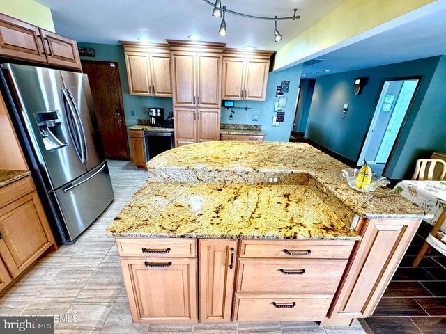 953 Capstan Dr, Forked River, NJ 08731 - kitchen featuring stainless steel fridge, light stone counters, and a kitchen island