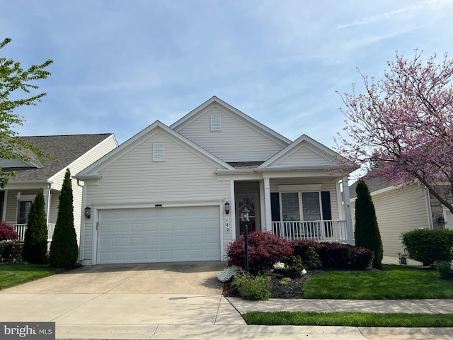 142 Saddletop Dr Unit 349, Taneytown, MD 21787 - view of front of home featuring a porch, driveway, an attached garage, and a front lawn