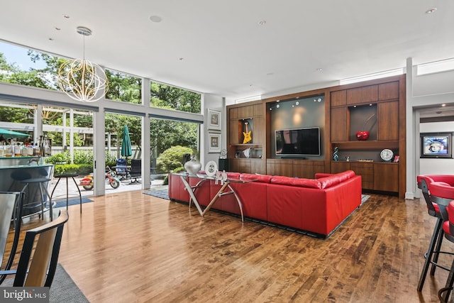1 Regency Ct Unit 1, Baltimore, MD 21208 - living area with wood finished floors and a chandelier