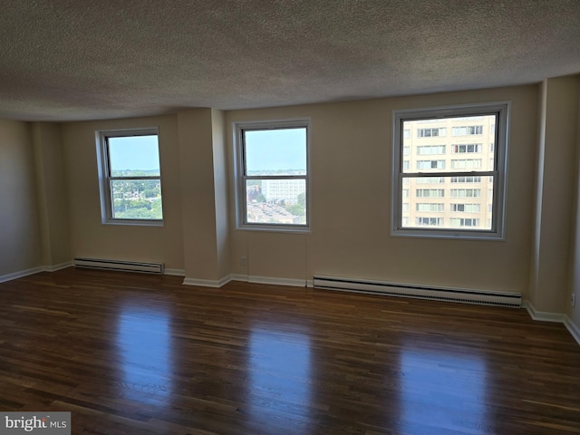1101 Saint Paul St Unit 1212, Baltimore, MD 21202 - empty room featuring a baseboard radiator, wood finished floors, and a textured ceiling