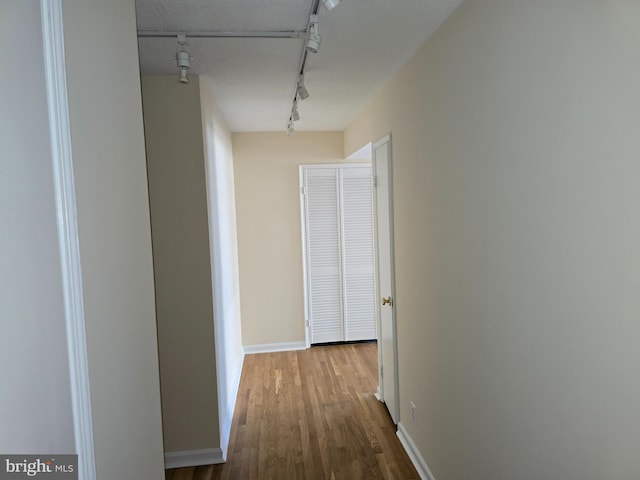 1101 Saint Paul St Unit 1212, Baltimore, MD 21202 - corridor featuring rail lighting and wood finished floors