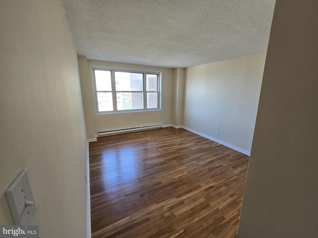 1101 Saint Paul St Unit 1212, Baltimore, MD 21202 - unfurnished room featuring a baseboard radiator, dark wood-style flooring, and a textured ceiling