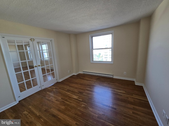 1101 Saint Paul St Unit 1212, Baltimore, MD 21202 - spare room with baseboard heating, french doors, wood finished floors, and a textured ceiling