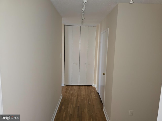 1101 Saint Paul St Unit 1212, Baltimore, MD 21202 - corridor with rail lighting and dark wood-style flooring