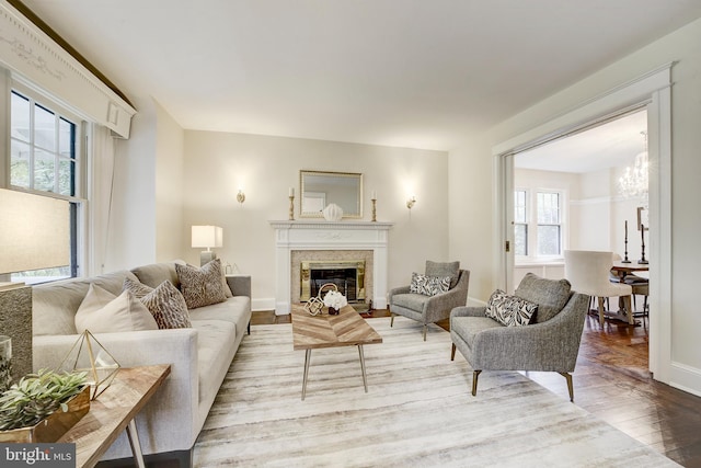 4110 Ingomar St NW, Washington, DC 20015 - living area featuring wood finished floors, a chandelier, and a glass covered fireplace
