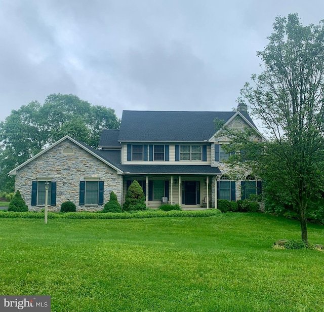 75 Autumnwood Dr, Middletown, PA 17057 - view of front of property featuring stone siding, a front lawn, and covered porch
