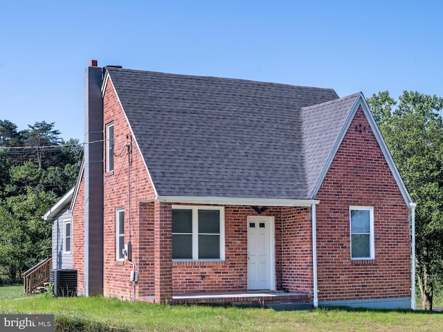 2450 Happy Creek Rd, Front Royal, VA 22630 - tudor house featuring a chimney, roof with shingles, and brick siding