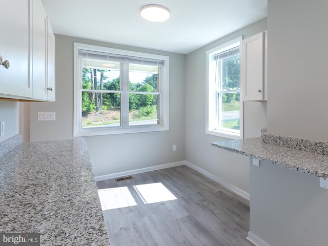 2450 Happy Creek Rd, Front Royal, VA 22630 - unfurnished dining area featuring healthy amount of natural light and light wood finished floors