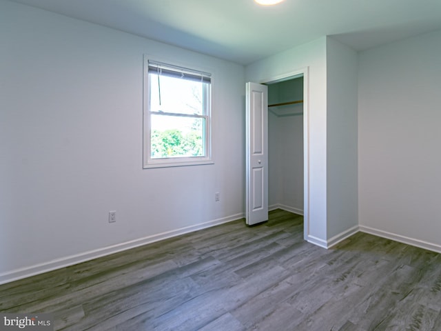 2450 Happy Creek Rd, Front Royal, VA 22630 - unfurnished bedroom with wood finished floors and a closet