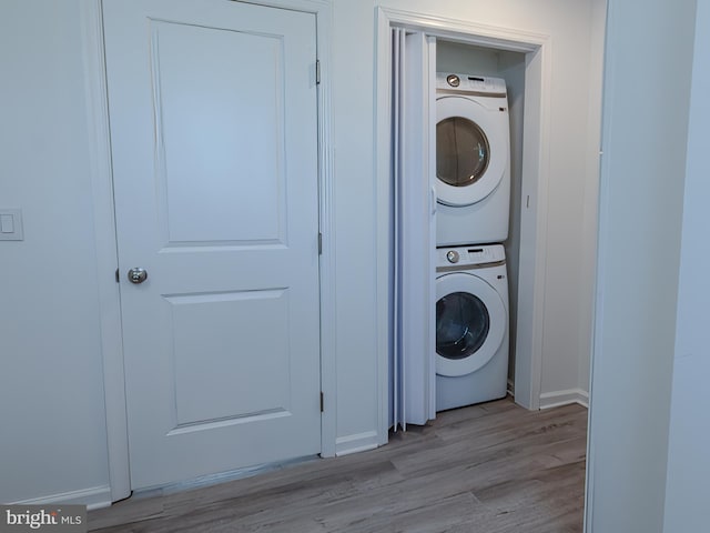 2450 Happy Creek Rd, Front Royal, VA 22630 - washroom featuring estacked washer and dryer and light wood-style flooring