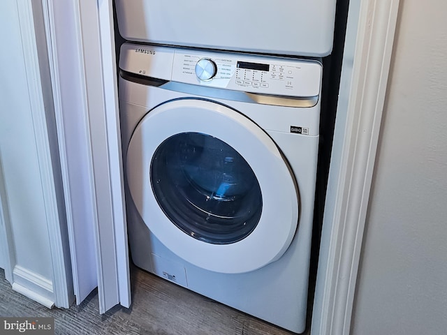 2450 Happy Creek Rd, Front Royal, VA 22630 - laundry area with stacked washer / drying machine and wood finished floors