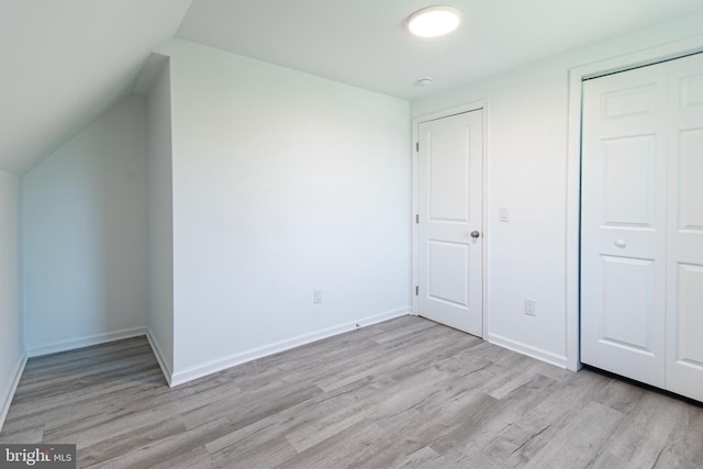 2450 Happy Creek Rd, Front Royal, VA 22630 - unfurnished bedroom with wood finished floors, a closet, and vaulted ceiling