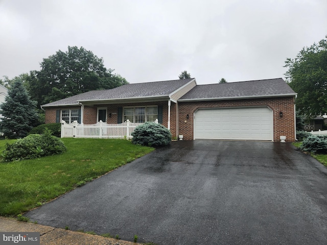 208 E 6th St, Lititz, PA 17543 - ranch-style house with brick siding, a garage, asphalt driveway, and roof with shingles