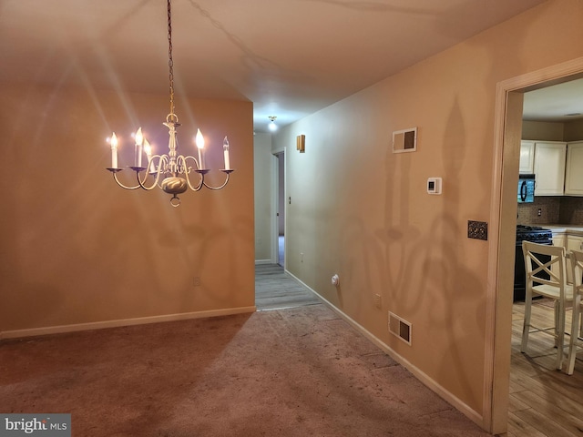 208 E 6th St, Lititz, PA 17543 - unfurnished dining area featuring a chandelier and carpet floors
