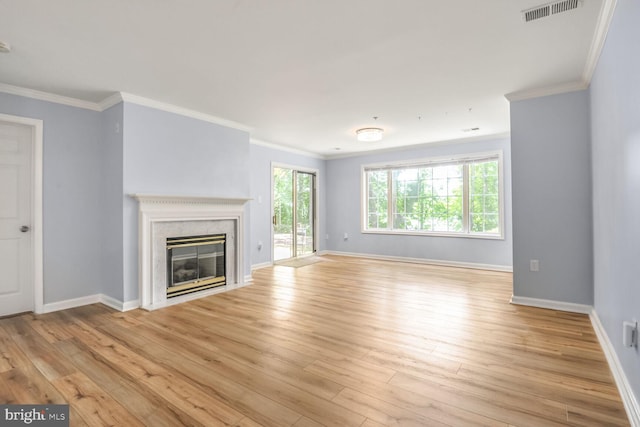 20406 Shore Harbour Dr Unit 4-A, Germantown, MD 20874 - unfurnished living room featuring light wood finished floors, crown molding, and a fireplace