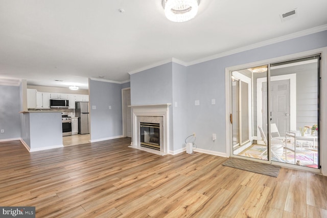 20406 Shore Harbour Dr Unit 4-A, Germantown, MD 20874 - unfurnished living room featuring light wood-style floors, crown molding, and a high end fireplace