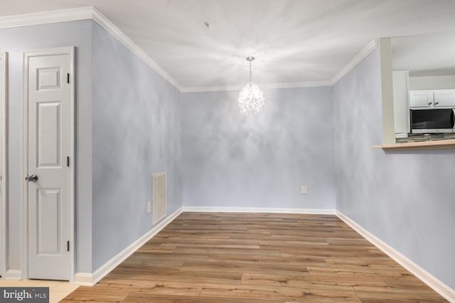 20406 Shore Harbour Dr Unit 4-A, Germantown, MD 20874 - unfurnished dining area featuring a chandelier, light wood finished floors, and crown molding