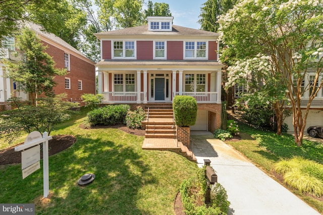 4621 Laverock Pl NW, Washington, DC 20007 - american foursquare style home featuring covered porch, driveway, stairs, a front yard, and a garage