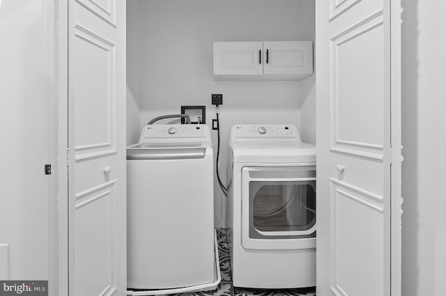 2002 E Lafayette Ave, Baltimore, MD 21213 - laundry room with independent washer and dryer and cabinet space