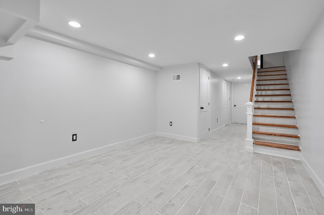 2002 E Lafayette Ave, Baltimore, MD 21213 - finished below grade area featuring recessed lighting, stairway, and light wood finished floors